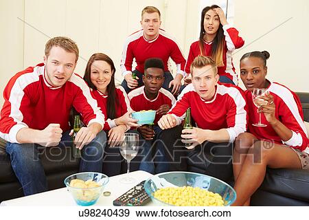 Group Of Sports Fans Watching Game On TV At Home View Large Photo Image Stock Photo - Group Of Sports Fans Watching Game On TV At Home. Fotosearch