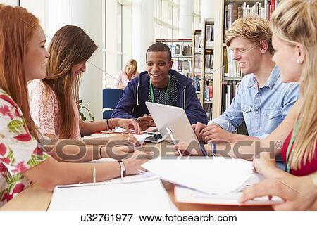 Stock Photo - Group Of Students Working Together In Library. Fotosearch