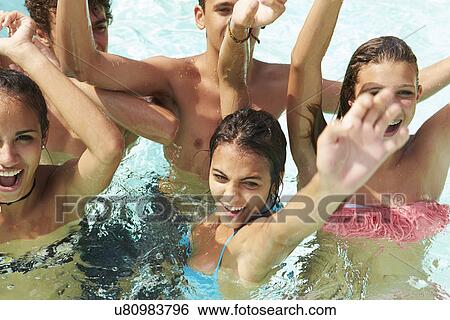 Group Of Teenage Friends Having Fun In Swimming Pool View Large Photo Image Stock Photograph - Group Of Teenage Friends Having Fun In Swimming Pool. Fotosearch