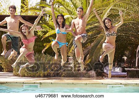 Group Of Teenage Friends Jumping Into Swimming Pool View Large Photo Image Stock Image - Group Of Teenage Friends Jumping Into Swimming Pool. Fotosearch