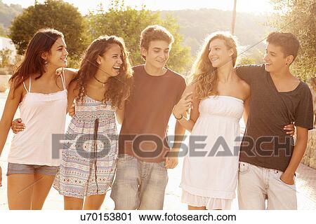 Group Of Teenage Friends Walking Along Street View Large Photo Image Stock Image - Group Of Teenage Friends Walking Along Street. Fotosearch
