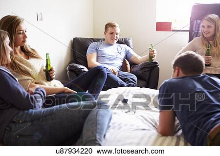 Group Of Teenagers Drinking Alcohol In Bedroom View Large Photo Image Stock Image - Group Of Teenagers Drinking Alcohol In Bedroom. Fotosearch