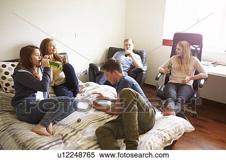 Group Of Teenagers Drinking Alcohol In Bedroom View Large Photo Image Stock Photography - Group Of Teenagers Drinking Alcohol In Bedroom. Fotosearch