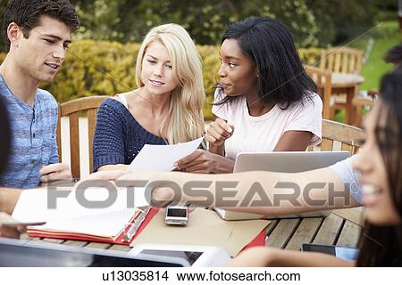 Picture - Group Of University Students Working On Project Outdoors. Fotosearch