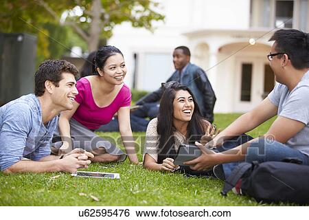 Stock Photograph - Group Of University Students Working Outside Together. Fotosearch