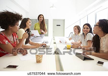 Group Of Women Working Together In Design Studio View Large Photo Image Picture - Group Of Women Working Together In Design Studio. Fotosearch