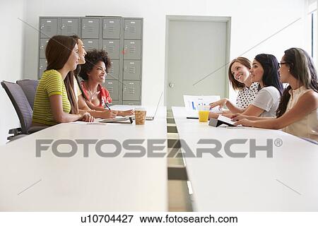 Group Of Women Working Together In Design Studio View Large Photo Image Stock Photo - Group Of Women Working Together In Design Studio. Fotosearch