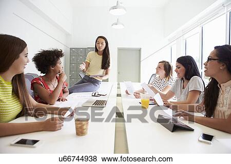 Group Of Women Working Together In Design Studio View Large Photo Image Stock Photo - Group Of Women Working Together In Design Studio. Fotosearch