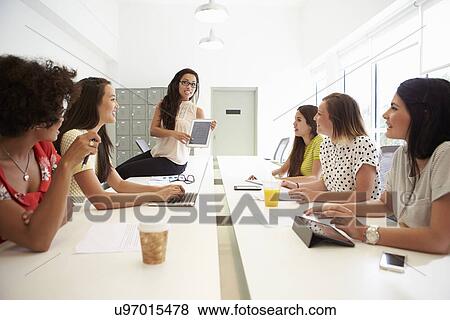 Stock Photo - Group Of Women Working Together In Design Studio. Fotosearch
