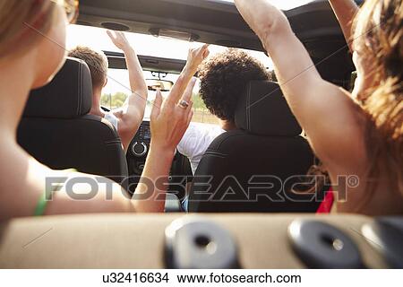 Group Of Young Friends Dancing In Back Of Open Top Car View Large Photo Image Picture - Group Of Young Friends Dancing In Back Of Open Top Car. Fotosearch