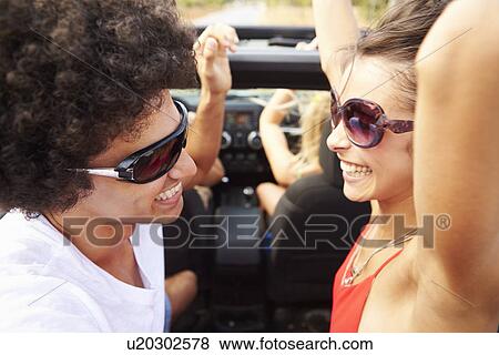 Group Of Young Friends Dancing In Back Of Open Top Car View Large Photo Image Stock Photo - Group Of Young Friends Dancing In Back Of Open Top Car. Fotosearch