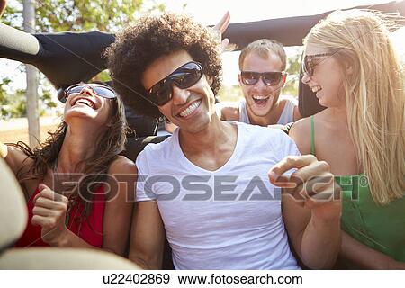 Group Of Young Friends Dancing In Back Of Open Top Car View Large Photo Image Stock Photo - Group Of Young Friends Dancing In Back Of Open Top Car. Fotosearch