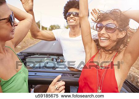 Group Of Young Friends Dancing In Back Of Open Top Car View Large Photo Image Stock Photography - Group Of Young Friends Dancing In Back Of Open Top Car. Fotosearch