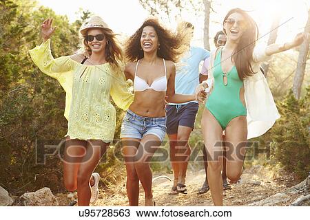 Group Of Young Friends Having Party On Beach Together View Large Photo Image Stock Image - Group Of Young Friends Having Party On Beach Together. Fotosearch