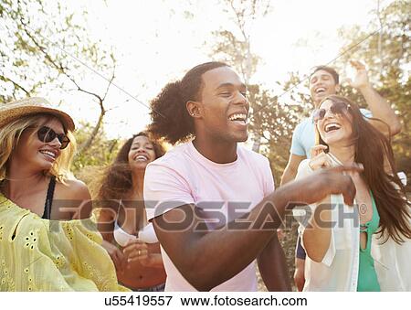 Group Of Young Friends Having Party On Beach Together View Large Photo Image Stock Photo - Group Of Young Friends Having Party On Beach Together. Fotosearch
