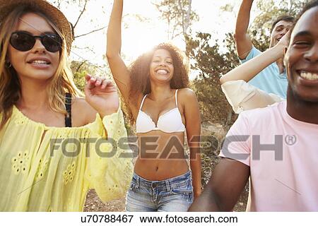 Group Of Young Friends Having Party On Beach Together View Large Photo Image Stock Photo - Group Of Young Friends Having Party On Beach Together. Fotosearch