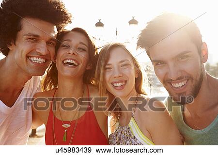 Stock Photo - Group Of Young Friends On Summer Holiday Together . Fotosearch