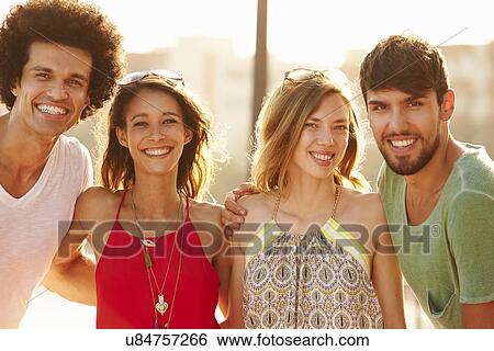 Stock Photograph - Group Of Young Friends On Summer Holiday Together . Fotosearch