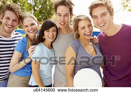 Group Of Young Friends Playing Volleyball Match View Large Photo Image Stock Image - Group Of Young Friends Playing Volleyball Match. Fotosearch