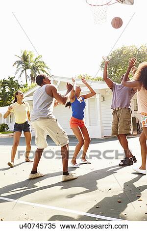 Group Of Young Friends Playing Basketball Match View Large Photo Image Stock Photography - Group Of Young Friends Playing Basketball Match. Fotosearch