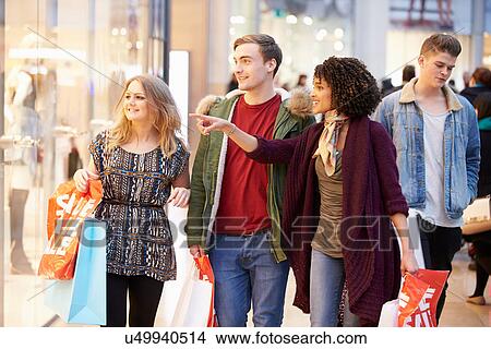 Group Of Young Friends Shopping In Mall Together View Large Photo Image Picture - Group Of Young Friends Shopping In Mall Together. Fotosearch