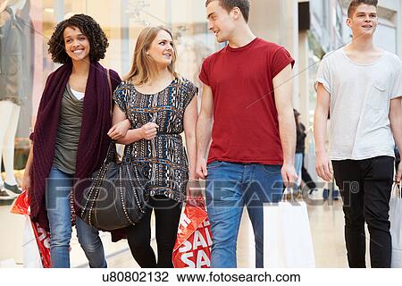 Group Of Young Friends Shopping In Mall Together View Large Photo Image Stock Image - Group Of Young Friends Shopping In Mall Together. Fotosearch