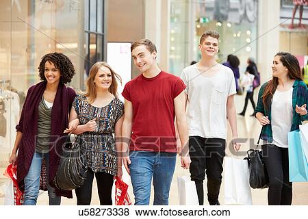 Group Of Young Friends Shopping In Mall Together View Large Photo Image Stock Photo - Group Of Young Friends Shopping In Mall Together. Fotosearch