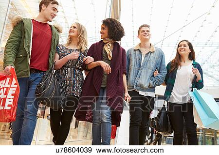 Group Of Young Friends Shopping In Mall Together View Large Photo Image Stock Photo - Group Of Young Friends Shopping In Mall Together. Fotosearch