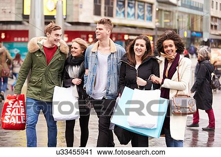 Group Of Young Friends Shopping Outdoors Together View Large Photo Image Stock Image - Group Of Young Friends Shopping Outdoors Together. Fotosearch