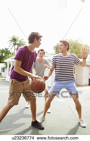 Group Of Young Men Playing Basketball Match View Large Photo Image Picture - Group Of Young Men Playing Basketball Match. Fotosearch
