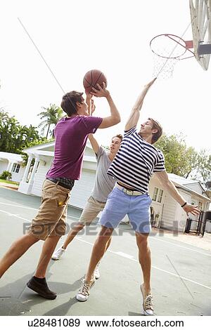 Group Of Young Men Playing Basketball Match View Large Photo Image Stock Photo - Group Of Young Men Playing Basketball Match. Fotosearch