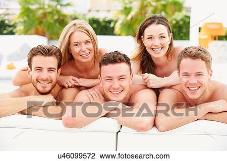 Group Of Young People On Holiday Relaxing By Swimming Pool View Large Photo Image Stock Image - Group Of Young People On Holiday Relaxing By Swimming Pool. Fotosearch