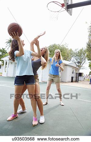 Group Of Young Women Playing Basketball Match View Large Photo Image Stock Photo - Group Of Young Women Playing Basketball Match. Fotosearch