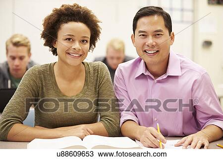 High School Student And Teacher Using Digital Tablet View Large Photo Image Stock Image - High School Student And Teacher Using Digital Tablet. Fotosearch