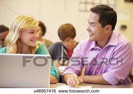 High School Student With Teacher In Class Using Laptop View Large Photo Image Stock Photograph - High School Student With Teacher In Class Using Laptop. Fotosearch