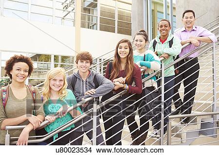 Picture - High School Students And Teacher Standing Outside Building. Fotosearch