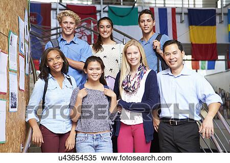 Stock Photography - High School Students And Teacher Standing Outside Building. Fotosearch