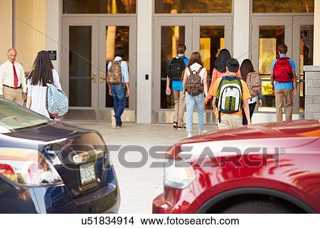 High School Students Being Dropped Off At School By Parents View Large Photo Image Picture - High School Students Being Dropped Off At School By Parents. Fotosearch