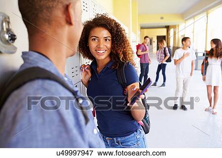 High School Students By Lockers Looking At Mobile Phone View Large Photo Image Stock Photo - High School Students By Lockers Looking At Mobile Phone. Fotosearch