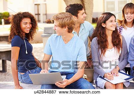 Stock Photo - High School Students Collaborating On Project On Campus. Fotosearch