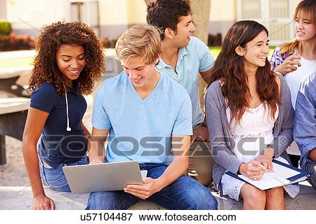 High School Students Collaborating On Project On Campus View Large Photo Image Stock Photo - High School Students Collaborating On Project On Campus. Fotosearch
