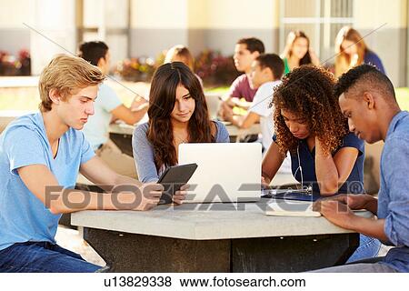 Stock Photo - High School Students Hanging Out On Campus . Fotosearch
