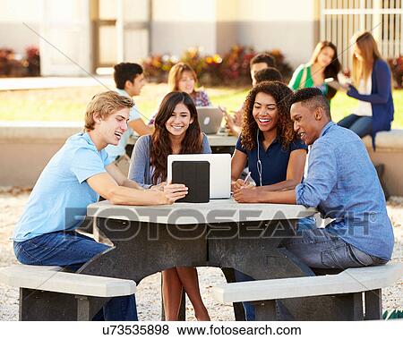 High School Students Hanging Out On Campus View Large Photo Image Stock Photo - High School Students Hanging Out On Campus . Fotosearch