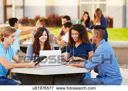 Stock Photo - High School Students Hanging Out On Campus . Fotosearch