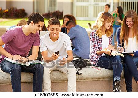 Stock Photography - High School Students Hanging Out On Campus . Fotosearch