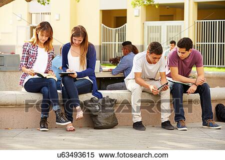 Stock Photography - High School Students Hanging Out On Campus . Fotosearch