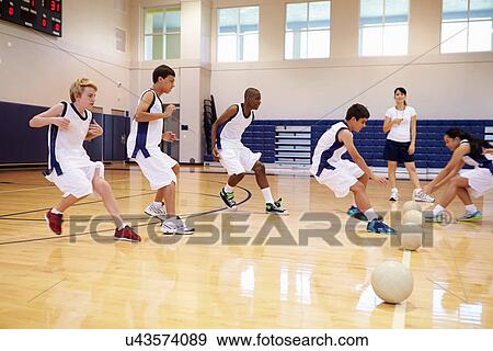 Stock Photo - High School Students Playing Dodge Ball In Gym. Fotosearch