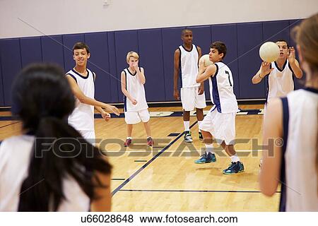 Stock Photo - High School Students Playing Dodge Ball In Gym. Fotosearch