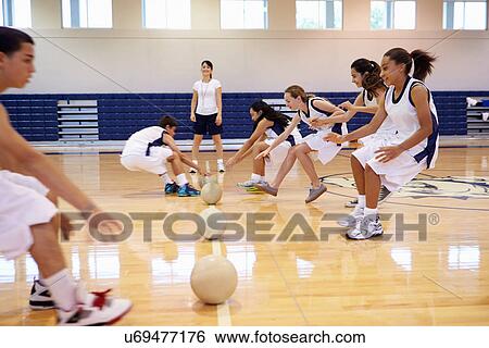 Stock Photograph - High School Students Playing Dodge Ball In Gym. Fotosearch