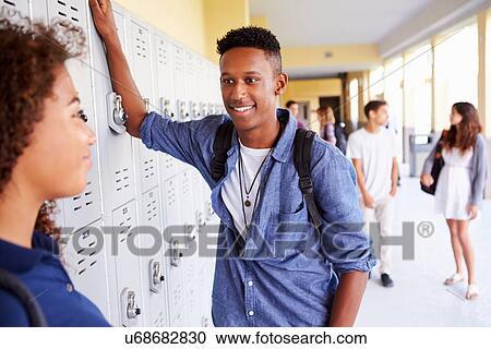 High School Students Standing By Lockers Talking View Large Photo Image Stock Image - High School Students Standing By Lockers Talking. Fotosearch